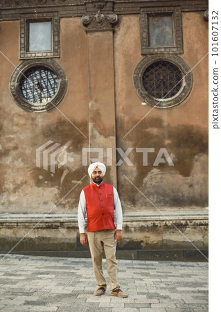 Indian man in a city. Male in a traditional turban. Hinduist in a summer city. Indian man in a city. Male in a traditional turban. Hinduist in a summer city. 101607132