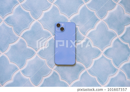 A woman's smartphone placed on a stylish table 101607357