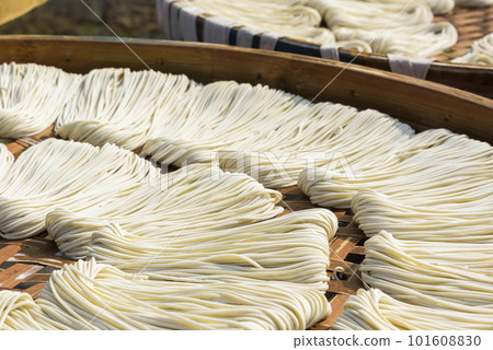Close-up of traditional handmade noodle-making drying outdoors in Guanmiao, Tainan, Taiwan. Close-up of traditional handmade noodle-making drying outdoors in Guanmiao, Tainan, Taiwan. 101608830