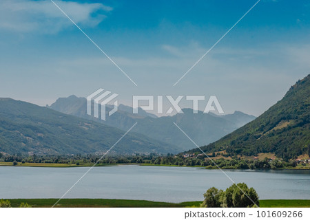 Montenegro. Kotor Bay. A picturesque view from the water to the coastal town of Dobrota. Kotor bay in a beautiful summer day, Montenegro Montenegro. Kotor Bay. A picturesque view from the water to the coastal town of Dobrota. Kotor bay in a beautiful summer day, Montenegro 101609266