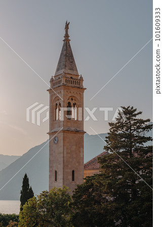 Beautiful Sunset view of the coast of Kotor Bay and St.Eustace's Church in the village Dobrota in Montenegro. Church of St. Eustachius is located in Dobrota , Kotor Montenegro. 101609333