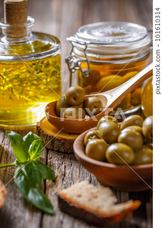 Green olives and olive oil Green olives and olive oil 101610314