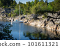 Sailboat anchored near remote rocky island in Stockholm archipelago. Adventure and travel concept 101611321