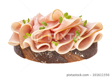 Pork ham slices on rye bread isolated on white background Pork ham slices on rye bread isolated on white background 101611350