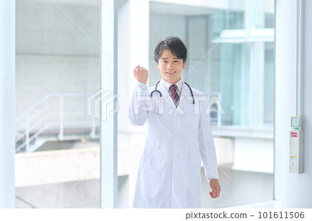 A veteran doctor in a white coat working in a hospital 101611506