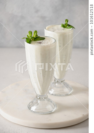 Indian Salty lassi with mint leaves and kala namak. 101612518