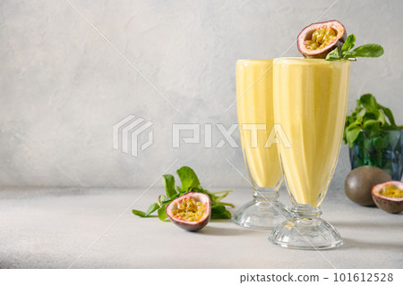 Indian mango or turmeric lassi on gray background 101612528