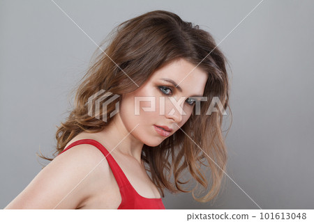 Portrait of elegant perfect fashion model woman with makeup and long wavy brown hair.  101613048