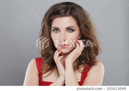 Attractive female face. Nice brunette woman with make-up and brown hair portrait 101613049