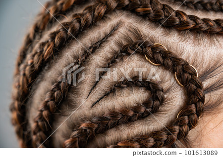 Close-up of braids on the head of a caucasian woman. 101613089