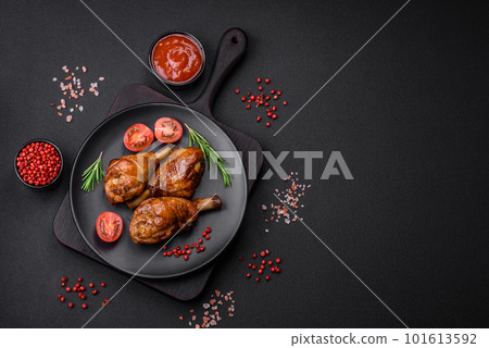 Delicious grilled chicken legs with spices and herbs in teriyaki sauce 101613592