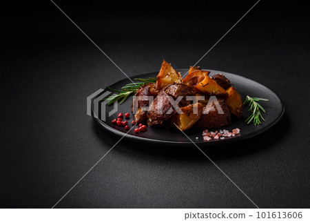 Delicious potatoes baked in their skins with rosemary and spices Delicious potatoes baked in their skins with rosemary and spices 101613606