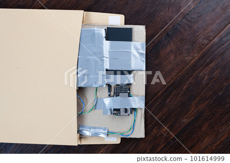 Mail bomb IED. Hand made Improvised Explosive Device with plastic explosive C-4 and cell phone module in envelope 101614999