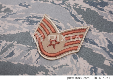 August 31, 2020. US AIR FORCE Staff Sergeant rank patch on digital tiger-stripe pattern Airman Battle Uniform (ABU) background August 31, 2020. US AIR FORCE Staff Sergeant rank patch on digital tiger-stripe pattern Airman Battle Uniform (ABU) background 101615037