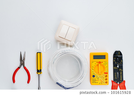 Stripper, Pliers, Multimeter, Wire, switch and Screwdriver on a white background Stripper, Pliers, Multimeter, Wire, switch and Screwdriver on a white background 101615928