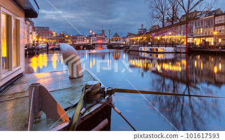 Beautiful old houses on the city embankment of Leiden at sunset. 101617593