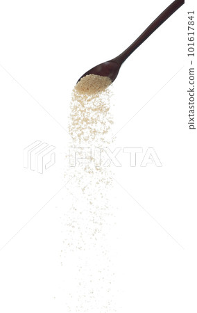 Brown Sugar fall, brown grain sugar pouring down abstract cloud fly from wooden spoon. Beautiful complete seed sugarcane, food object design. Selective focus freeze shot white background isolated 101617841