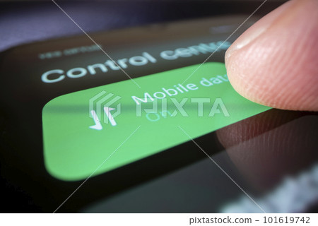 Macro shot of turning on mobile data on a smartphone, shot with macro probe lens 101619742