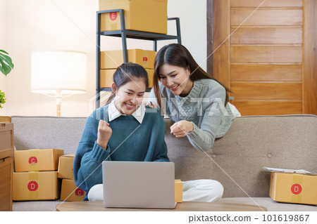 Small businesses SME owners and partnership entrepreneurs check online orders to prepare to pack the boxes, sell to customers, sme business ideas online 101619867