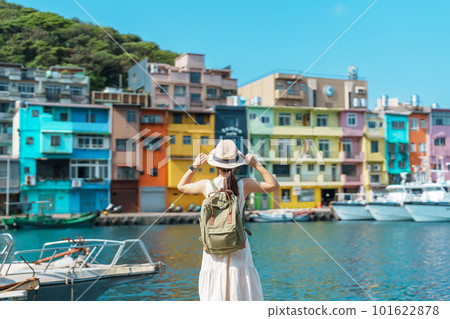 woman traveler visiting in Taiwan, Tourist with backpack and hat sightseeing in Keelung, Colorful Zhengbin Fishing Port, landmark and popular attractions near Taipei city . Asia Travel concept woman traveler visiting in Taiwan, Tourist with backpack and hat sightseeing in Keelung, Colorful Zhengbin Fishing Port, landmark and popular attractions near Taipei city . Asia Travel concept 101622878
