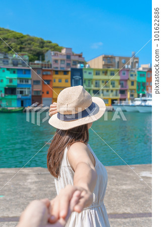 Couple traveler visiting in Taiwan, Tourist sightseeing in Keelung, Colorful Zhengbin Fishing Port, landmark and popular attractions near Taipei city. trip, love, together and summer vacation concept 101622886