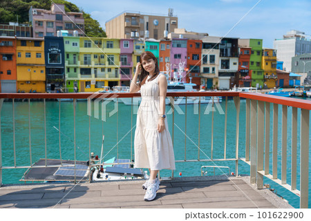 woman traveler visiting in Taiwan, Tourist with hat sightseeing in Keelung, Colorful Zhengbin Fishing Port, landmark and popular attractions near Taipei city . Asia Travel concept woman traveler visiting in Taiwan, Tourist with hat sightseeing in Keelung, Colorful Zhengbin Fishing Port, landmark and popular attractions near Taipei city . Asia Travel concept 101622900