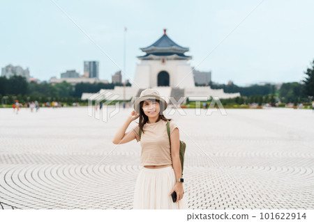 woman traveler visiting in Taiwan, Tourist with hat sightseeing in National Chiang Kai shek Memorial or Hall Freedom Square, Taipei City. landmark and popular attractions. Asia Travel concept 101622914
