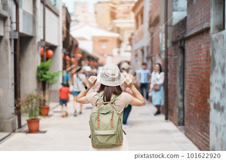 woman traveler visiting in Taiwan, Tourist with backpack and hat sightseeing in Bopiliao Historic Block, landmark and popular attractions in Taipei city. Asia Travel 101622920