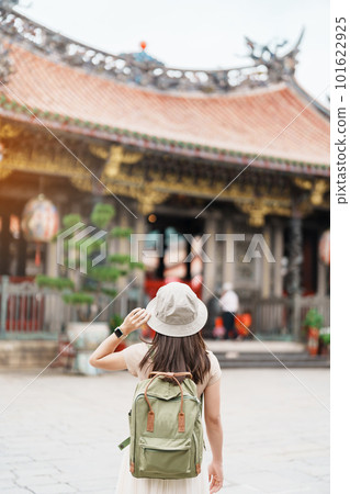 woman traveler visiting in Taiwan, Tourist with hat sightseeing in Longshan Temple, Chinese folk religious temple in Wanhua District, Taipei City. landmark and popular. Travel and Vacation concept woman traveler visiting in Taiwan, Tourist with hat sightseeing in Longshan Temple, Chinese folk religious temple in Wanhua District, Taipei City. landmark and popular. Travel and Vacation concept 101622925