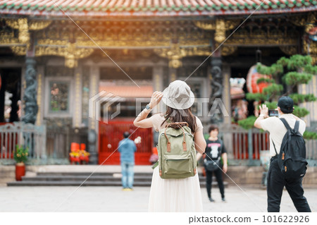 woman traveler visiting in Taiwan, Tourist with hat sightseeing in Longshan Temple, Chinese folk religious temple in Wanhua District, Taipei City. landmark and popular. Travel and Vacation concept woman traveler visiting in Taiwan, Tourist with hat sightseeing in Longshan Temple, Chinese folk religious temple in Wanhua District, Taipei City. landmark and popular. Travel and Vacation concept 101622926