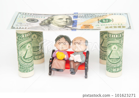 miniature people. a couple of pensioners under the house of dollars 101623271