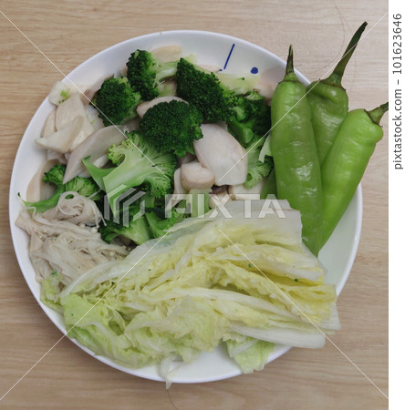 Mix of boiled organic broccoli , chinese cabbage, green chili peppers and mushroom on white plate at healthy gourmet restaurant, advertisement backgrounds Mix of boiled organic broccoli , chinese cabbage, green chili peppers and mushroom on white plate at healthy gourmet restaurant, advertisement backgrounds 101623646