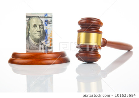 gavel of justice on the background of dollars. corruption in law. buying a judgment gavel of justice on the background of dollars. corruption in law. buying a judgment 101623684