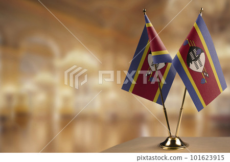 Small flags of the Swaziland on an abstract blurry background Small flags of the Swaziland on an abstract blurry background 101623915