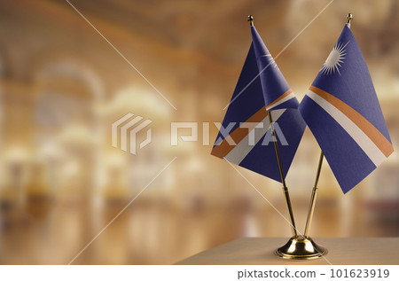 Small flags of the Marshall on an abstract blurry background Small flags of the Marshall on an abstract blurry background 101623919