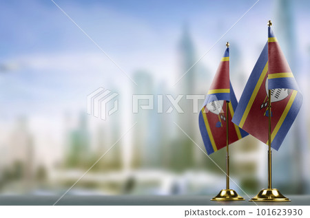 Small flags of the Swaziland on an abstract blurry background Small flags of the Swaziland on an abstract blurry background 101623930