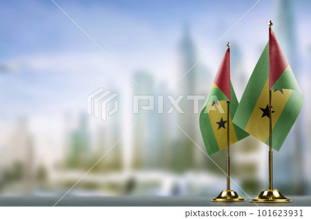 Small flags of the Sao Tome and Principe on an abstract blurry background Small flags of the Sao Tome and Principe on an abstract blurry background 101623931