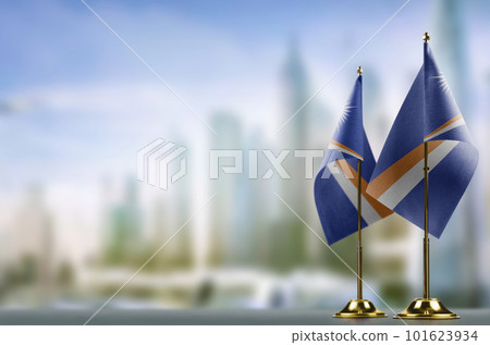 Small flags of the Marshall on an abstract blurry background Small flags of the Marshall on an abstract blurry background 101623934