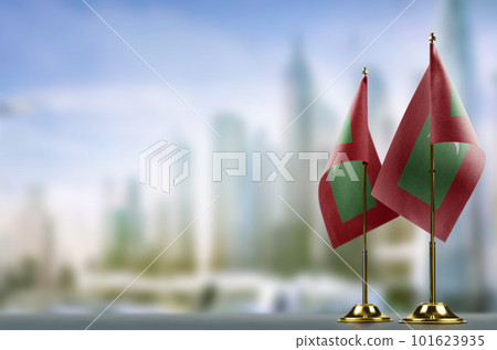 Small flags of the Maldives on an abstract blurry background 101623935