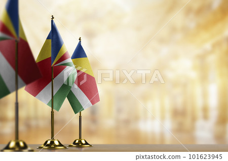 Small flags of the Seychelles on an abstract blurry background Small flags of the Seychelles on an abstract blurry background 101623945