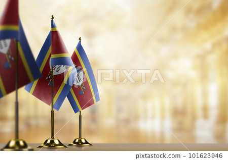 Small flags of the Swaziland on an abstract blurry background Small flags of the Swaziland on an abstract blurry background 101623946