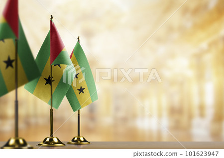 Small flags of the Sao Tome and Principe on an abstract blurry background Small flags of the Sao Tome and Principe on an abstract blurry background 101623947