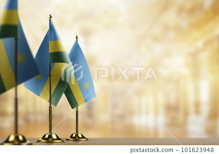 A small Rwanda flag on an abstract blurry background 101623948