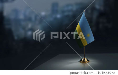 A small Rwanda flag on an abstract blurry background 101623978