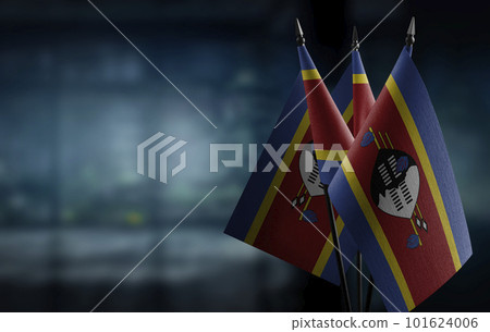 Small flags of the Swaziland on an abstract blurry background Small flags of the Swaziland on an abstract blurry background 101624006
