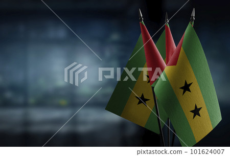 Small flags of the Sao Tome and Principe on an abstract blurry background Small flags of the Sao Tome and Principe on an abstract blurry background 101624007