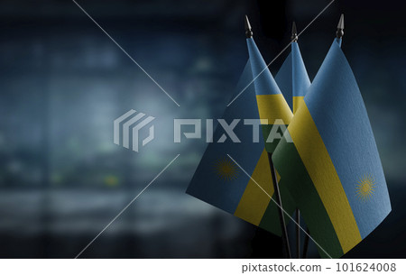 A small Rwanda flag on an abstract blurry background A small Rwanda flag on an abstract blurry background 101624008