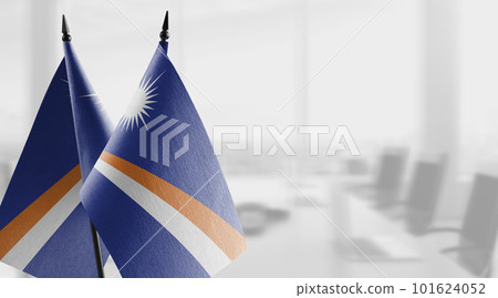 Small flags of the Marshall on an abstract blurry background 101624052