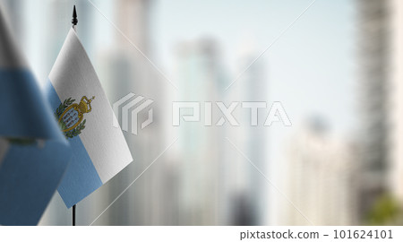 Small flags of the San Marino on an abstract blurry background Small flags of the San Marino on an abstract blurry background 101624101