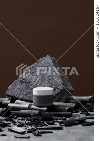 Cream jar, gray stone and bamboo charcoal on dark background. Mock up cream container. Skin care concept. Organic cosmetics, beauty products concept 101624167